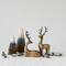 Hello Honey® 11.75" Natural & Black Mango Wood Lying Reindeer with Aluminum Antlers